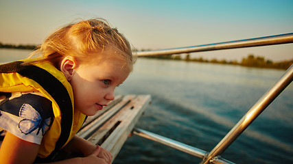 Image showing Little girl enjoying ride on yacht