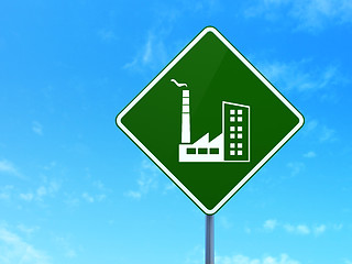 Image showing Manufacuring concept: Industry Building on road sign background