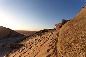 Image showing Rock formation in Namib desert in sunset, landscape