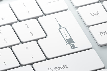 Image showing Healthcare concept: Syringe on computer keyboard background