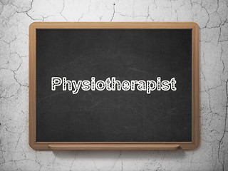 Image showing Health concept: Physiotherapist on chalkboard background