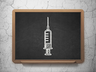 Image showing Medicine concept: Syringe on chalkboard background