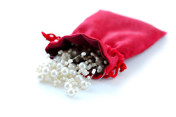 Image showing Pearls in red pouch