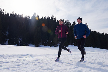 Image showing couple jogging outside on snow