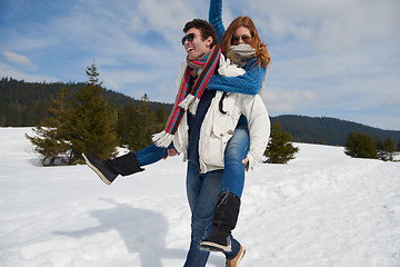 Image showing happy young couple having fun on fresh show on winter vacation