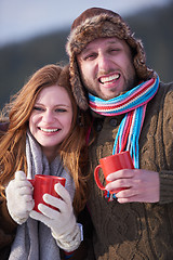 Image showing couple drink warm tea at winter