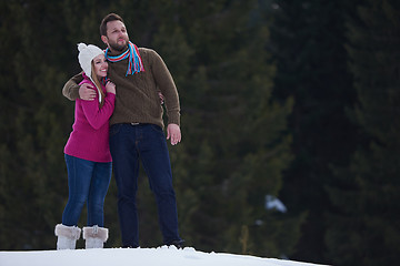 Image showing couple having fun and walking in snow shoes