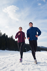 Image showing couple jogging outside on snow