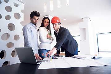 Image showing couple buying new home with real estate agent