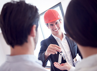 Image showing couple buying new home with real estate agent