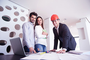 Image showing couple buying new home with real estate agent