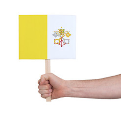 Image showing Hand holding small card - Flag of Vatican City