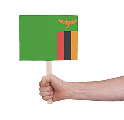 Image showing Hand holding small card - Flag of Zambia