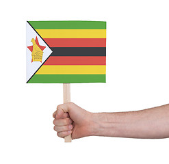 Image showing Hand holding small card - Flag of Zimbabwe