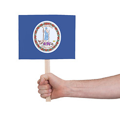 Image showing Hand holding small card - Flag of Virginia