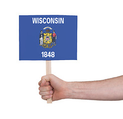 Image showing Hand holding small card - Flag of Wisconsin