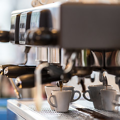 Image showing Professional coffee machine making espresso.