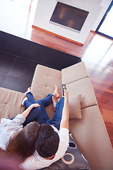 Image showing young couple watching tv at home