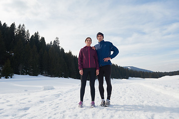 Image showing couple jogging outside on snow