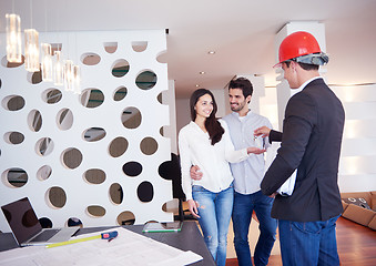 Image showing couple buying new home with real estate agent