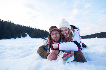 Image showing couple having fun and walking in snow shoes