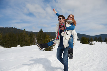 Image showing happy young couple having fun on fresh show on winter vacation