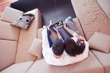 Image showing couple at modern home using tablet computer