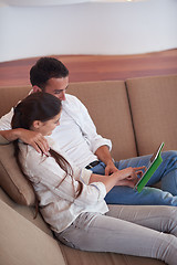 Image showing couple at modern home using tablet computer