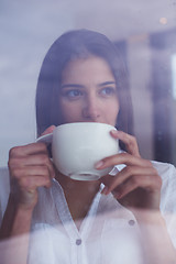 Image showing beautiful young woman drink first morning coffee