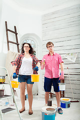 Image showing Young couple doing repair at home.