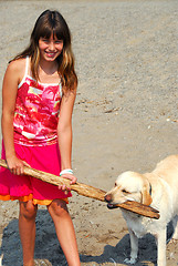 Image showing Girl play dog