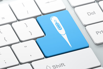 Image showing Healthcare concept: Thermometer on computer keyboard background