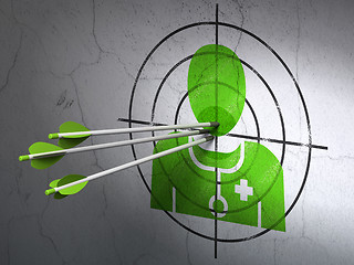 Image showing Medicine concept: arrows in Doctor target on wall background