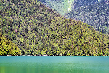 Image showing A picturesque lake surrounded by high mountains.