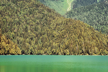 Image showing A picturesque lake surrounded by high mountains.