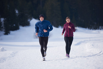 Image showing couple jogging outside on snow