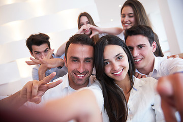 Image showing group of friends taking selfie