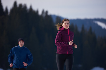 Image showing couple jogging outside on snow