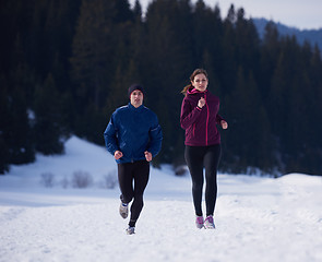 Image showing couple jogging outside on snow