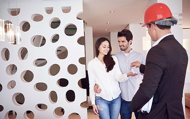 Image showing couple buying new home with real estate agent