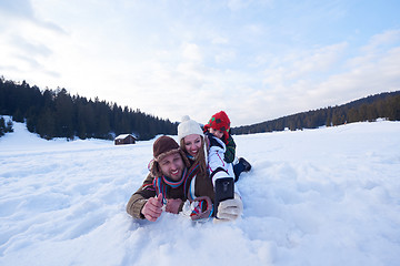 Image showing romantic couple have fun in fresh snow and taking selfie