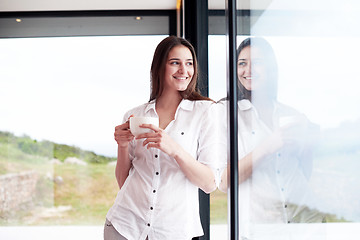 Image showing beautiful young woman drink first morning coffee