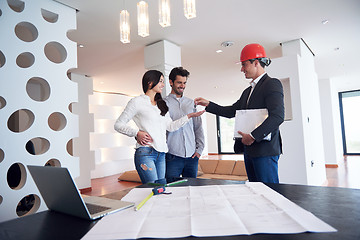 Image showing couple buying new home with real estate agent