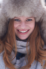 Image showing portrait of beautiful young redhair woman in snow scenery