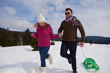 Image showing happy young couple having fun on fresh show on winter vacation