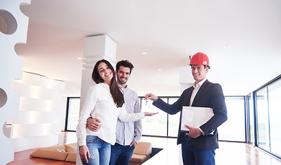 Image showing couple buying new home with real estate agent