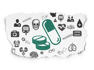 Image showing Health concept: Pills on Torn Paper background