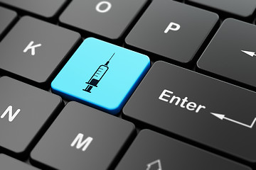Image showing Healthcare concept: Syringe on computer keyboard background