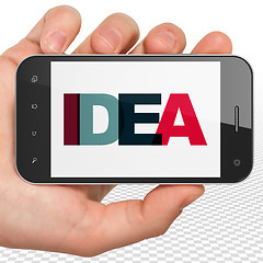 Image showing Advertising concept: Hand Holding Smartphone with Idea on  display