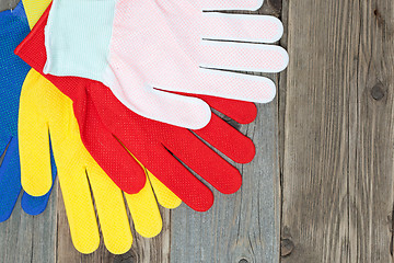 Image showing set of four colored construction gloves